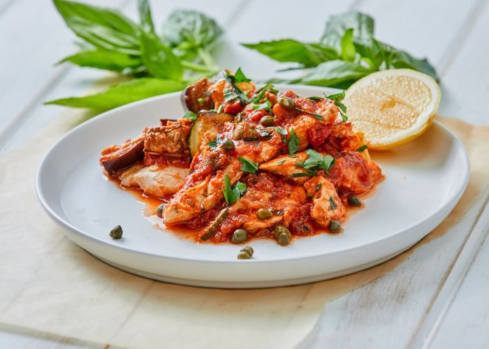 Chicken with tomato, capers + lemon